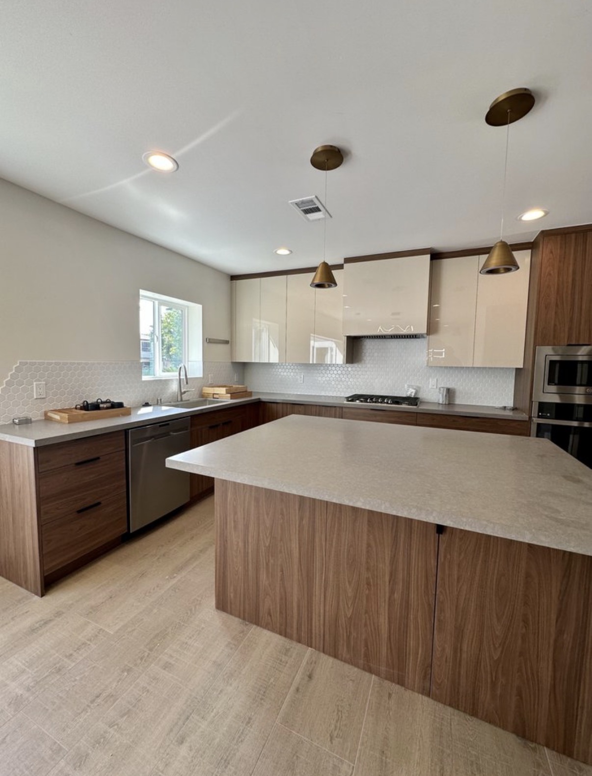 Modern walnut kitchen with quartz island