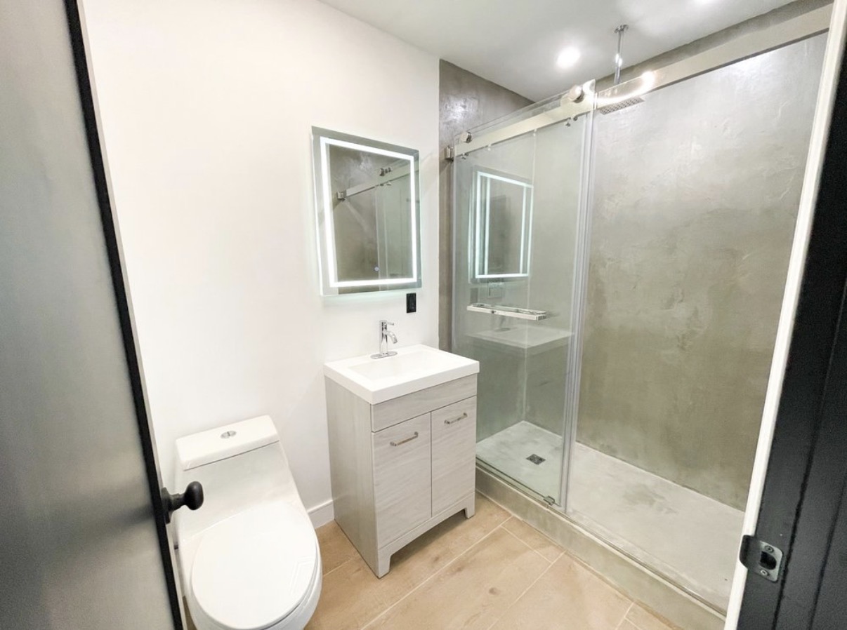 Compact bathroom remodel with LED mirror