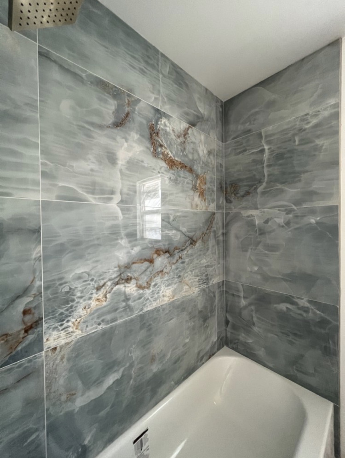 Onyx-look tub surround tile work