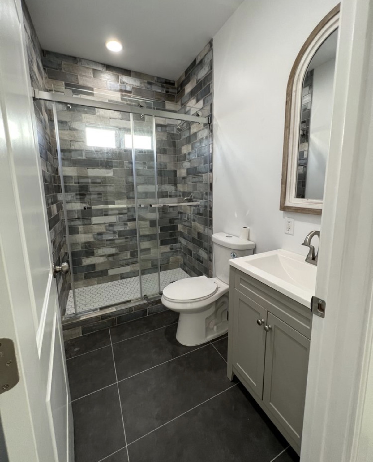 Stone-tile guest bathroom remodel